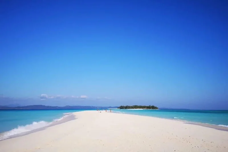 A white sandbar between turquoise water near Nosy Be